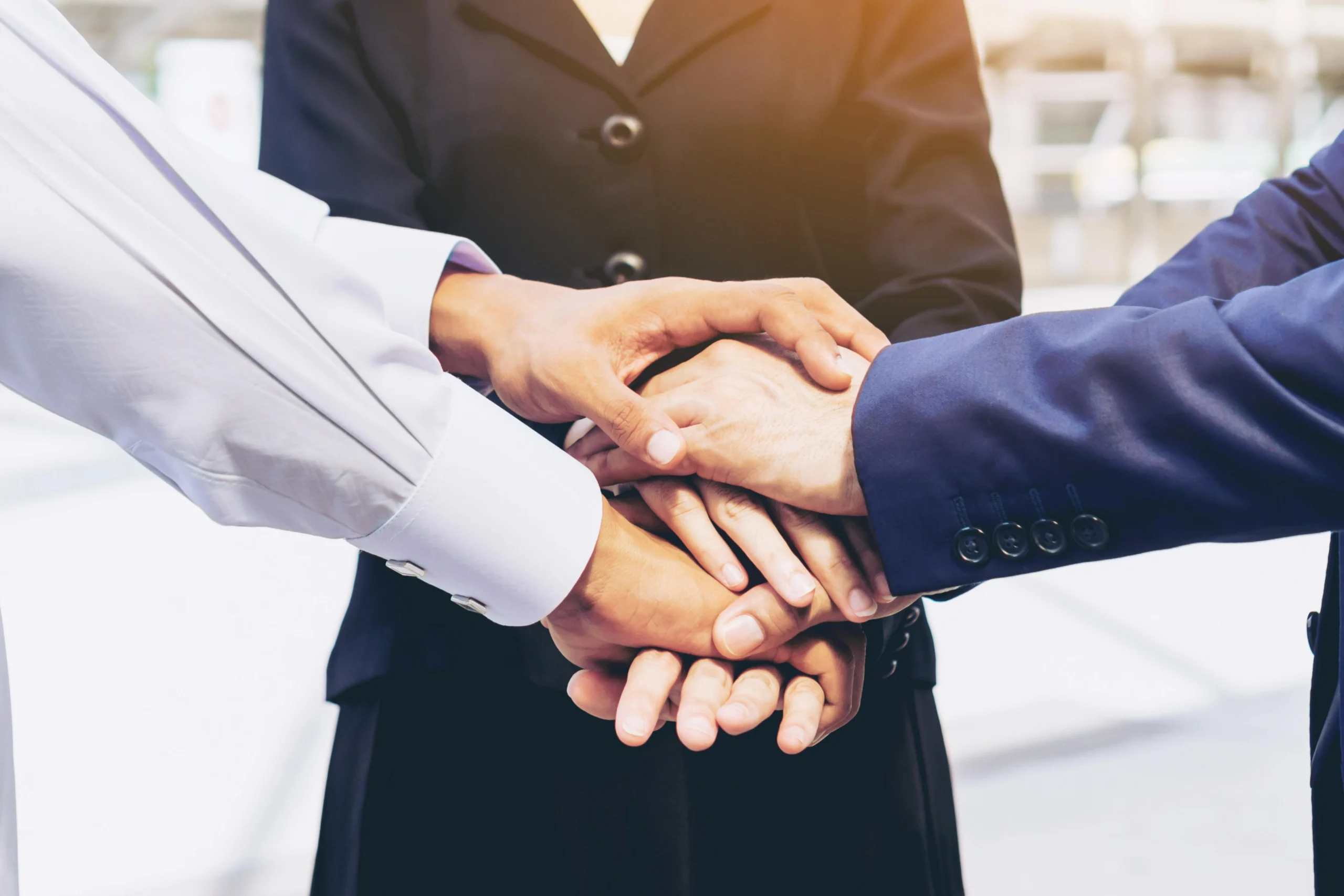 business-people-teamwork-stacking-hands-business-concept our foundation