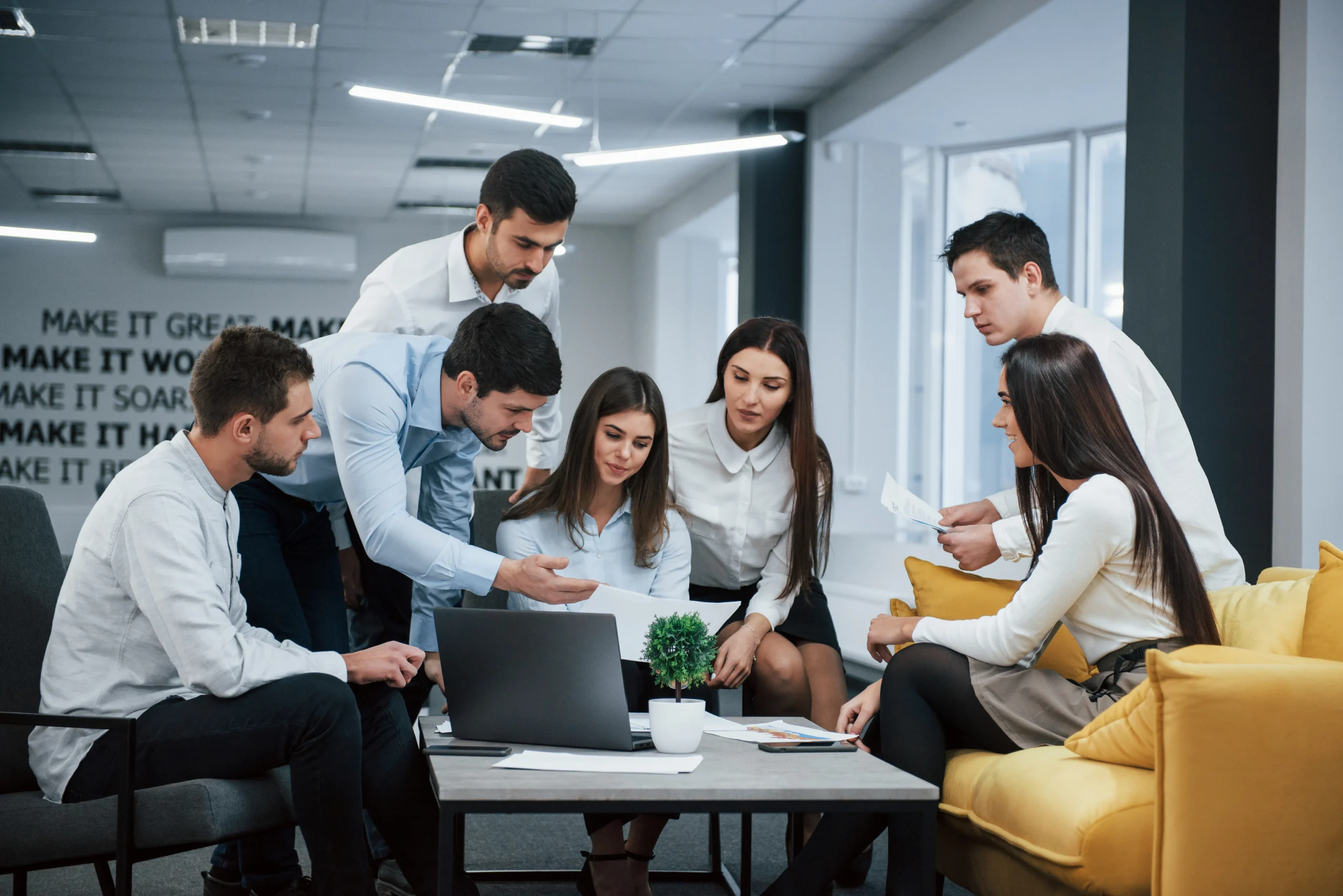 guy-shows-document-girl-group-young-freelancers-office-have-conversation-working guy-shows-document-girl-group-young-freelancers-office-have-conversation-working